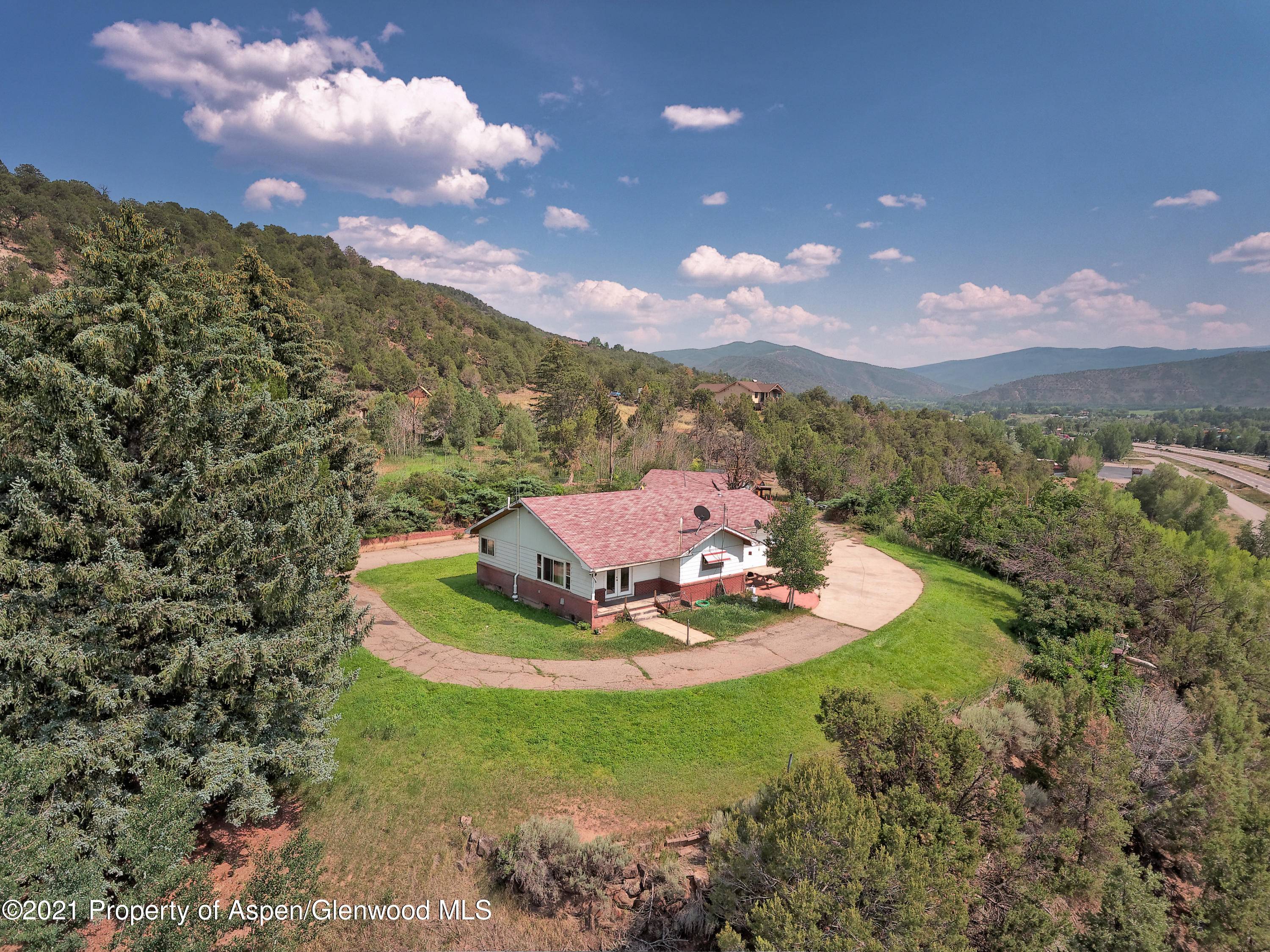 Boasting views up and down the valley, this home on the hill is poised with potential.