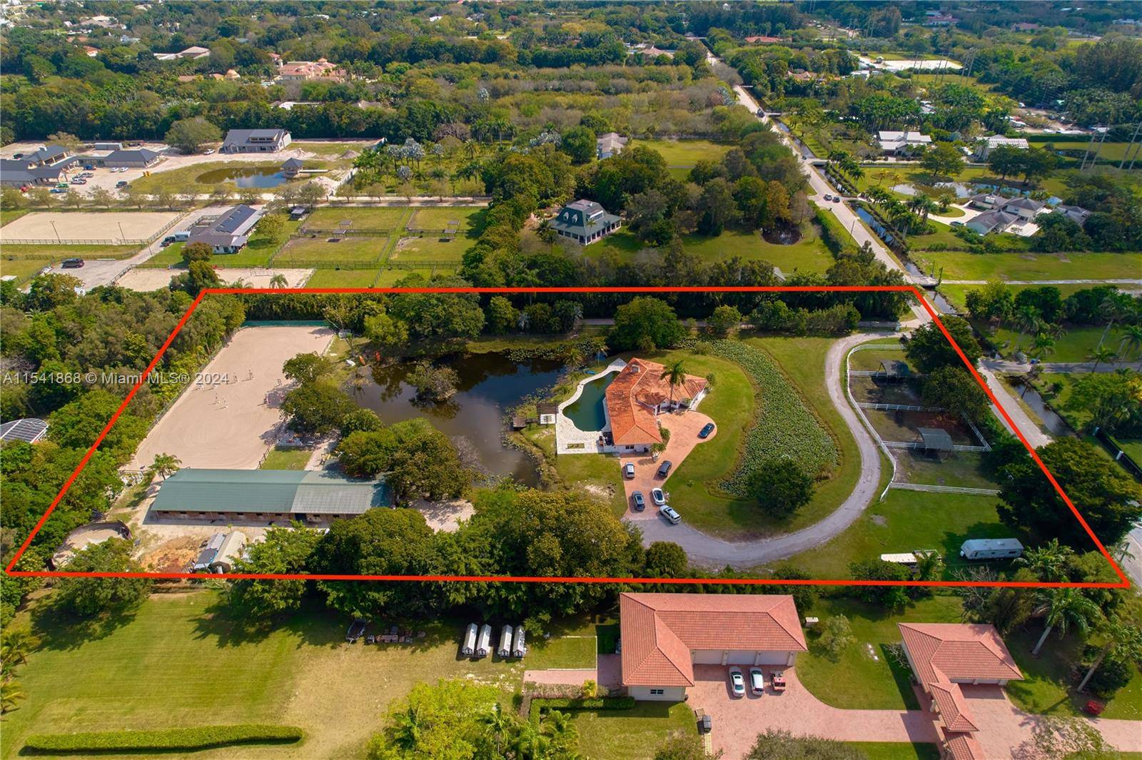 Immerse yourself in the epitome of equestrian luxury on nearly 5 acres in Sunshine Ranches.