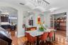 Formal dining room opens beautifully toward the kitchen and living areas.