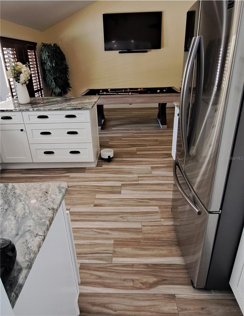 From dining room entering kitchen