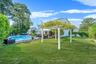 View of pool featuring a pergola and a patio