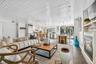 Living area with a glass covered fireplace and wood finished floors