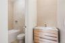 Full bath with vanity and toilet at guest apartment