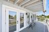 Covered deck seating area with French door access to the livingroom.