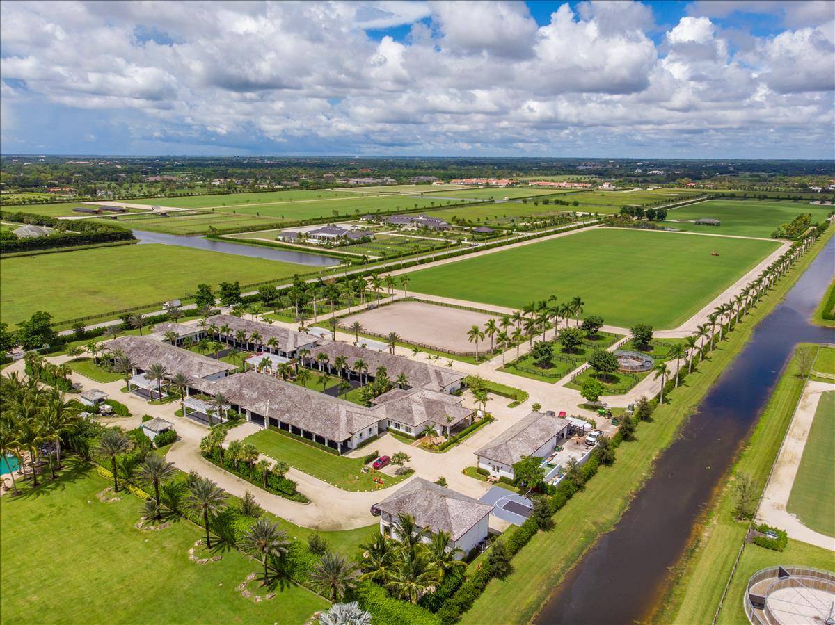 The epitome of luxurious practicality, this nearly 55 acre farm in Wellington Preserve is the ultimate equestrian compound.