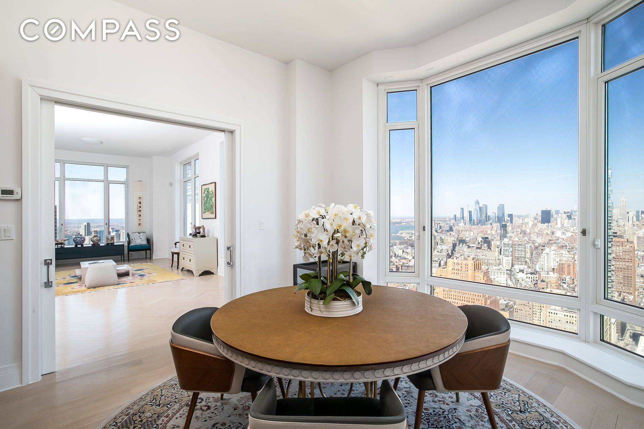 Perched on the northwest corner on the 61st floor with views of the Midtown skyline and the Hudson River, 61A is a stunning offering from the Four Seasons Private Residences.
