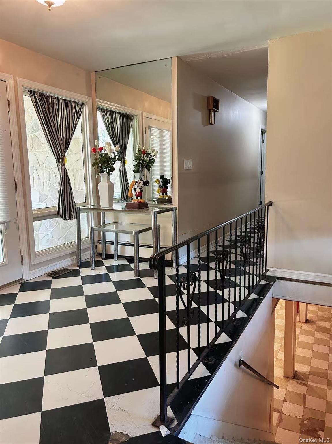 Staircase featuring tile patterned floors