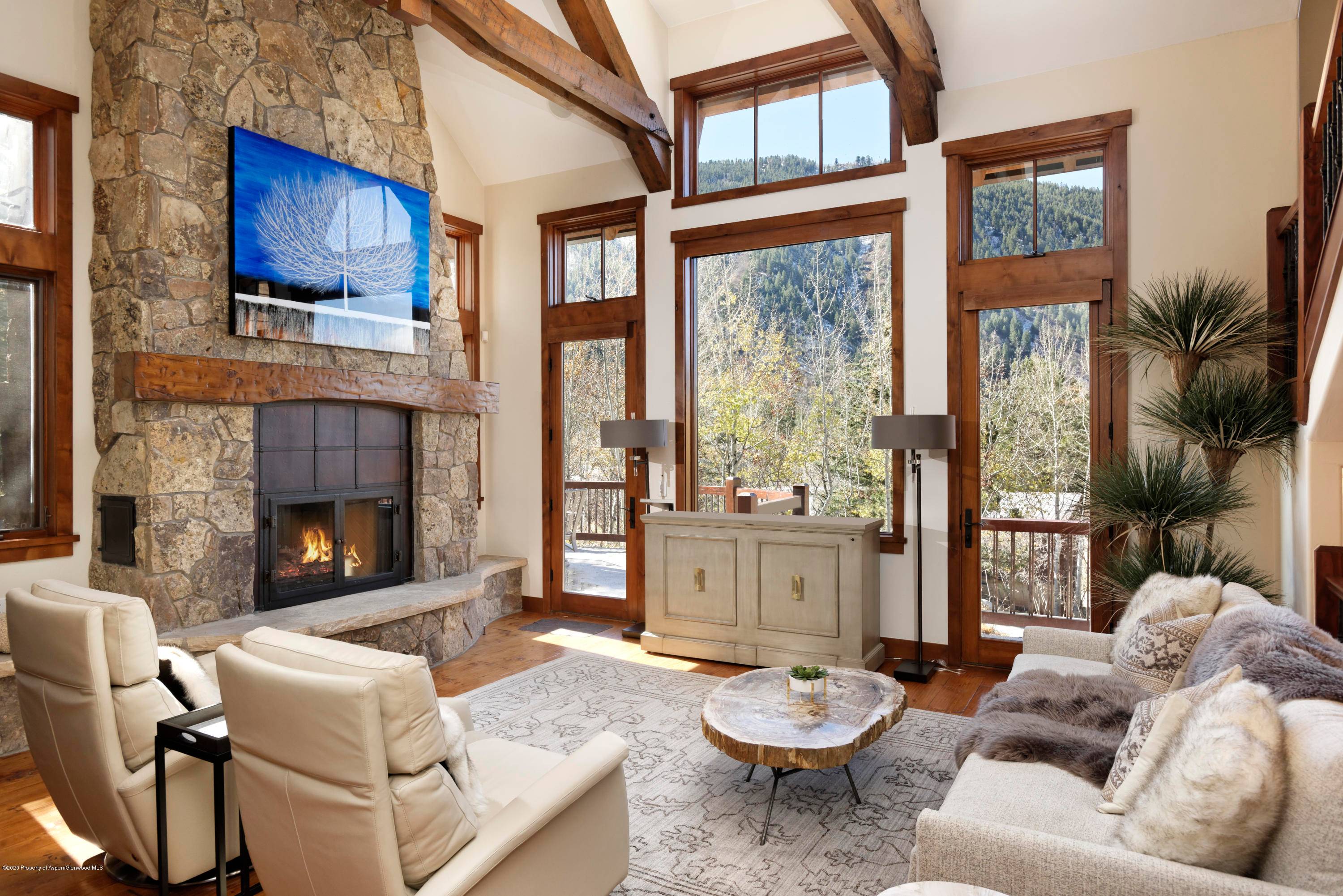Wonderfully maintained mountain style half duplex in Mountain Valley offering four luxurious suites and abundant views of Aspen Mountain.