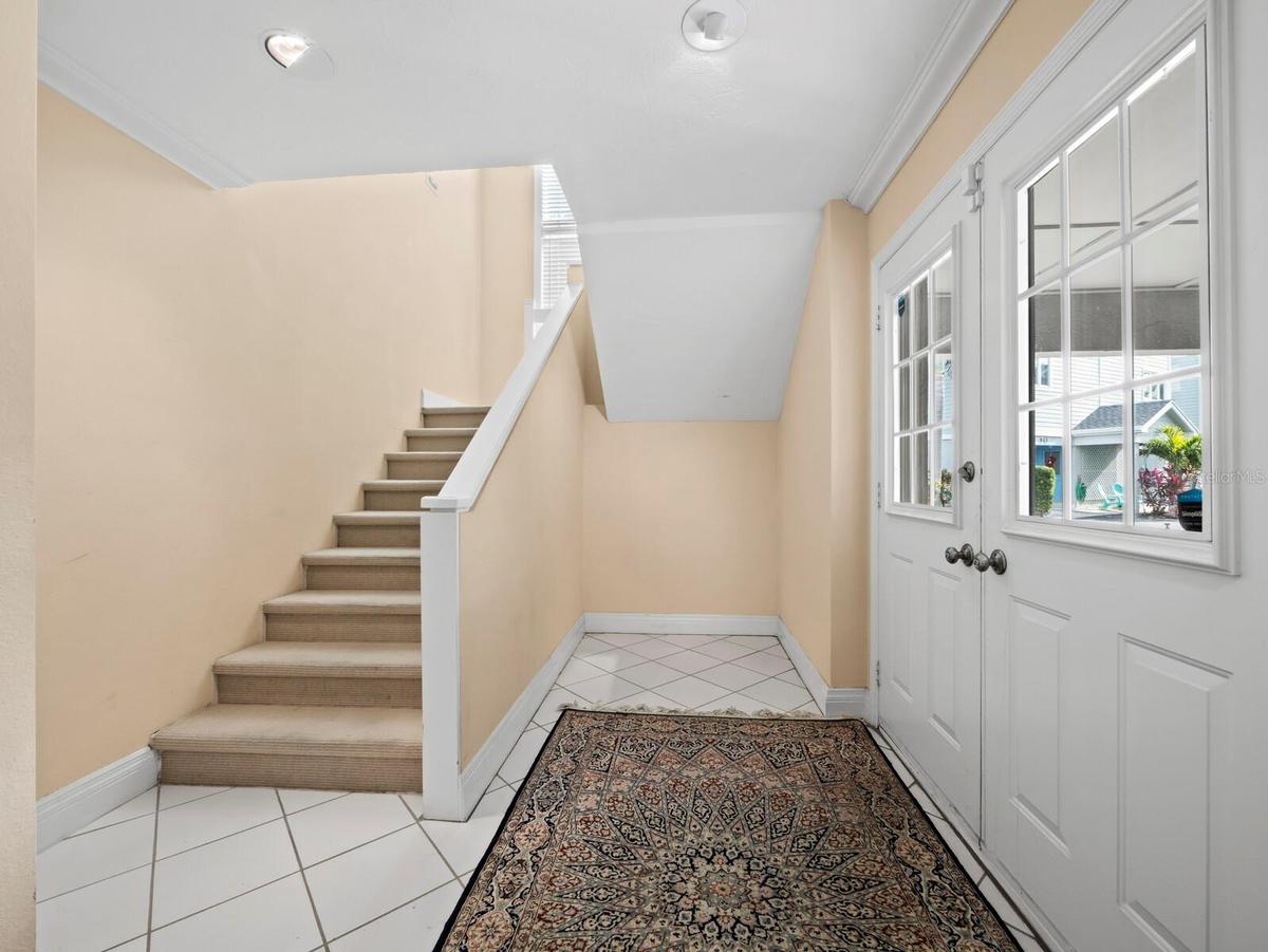 Stairs to main living level...there is a shaft to accommodate an elevator!