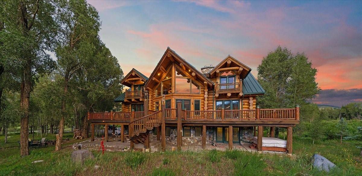 This beautiful log home is nestled against the Ptarmigan Peak Wilderness the Blue River runs just beyond.