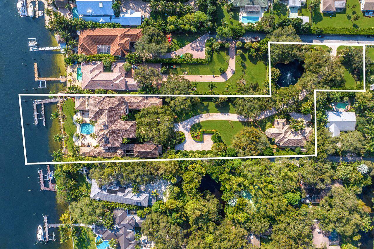 Experience the ultimate in waterfront living with this majestic estate sprawling nearly 3 acres of direct intracoastal waterway in the heart of Palm Beach Gardens.