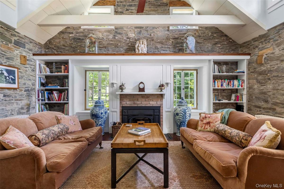 Original stone walls, vaulted ceiling and wood-burning fireplace