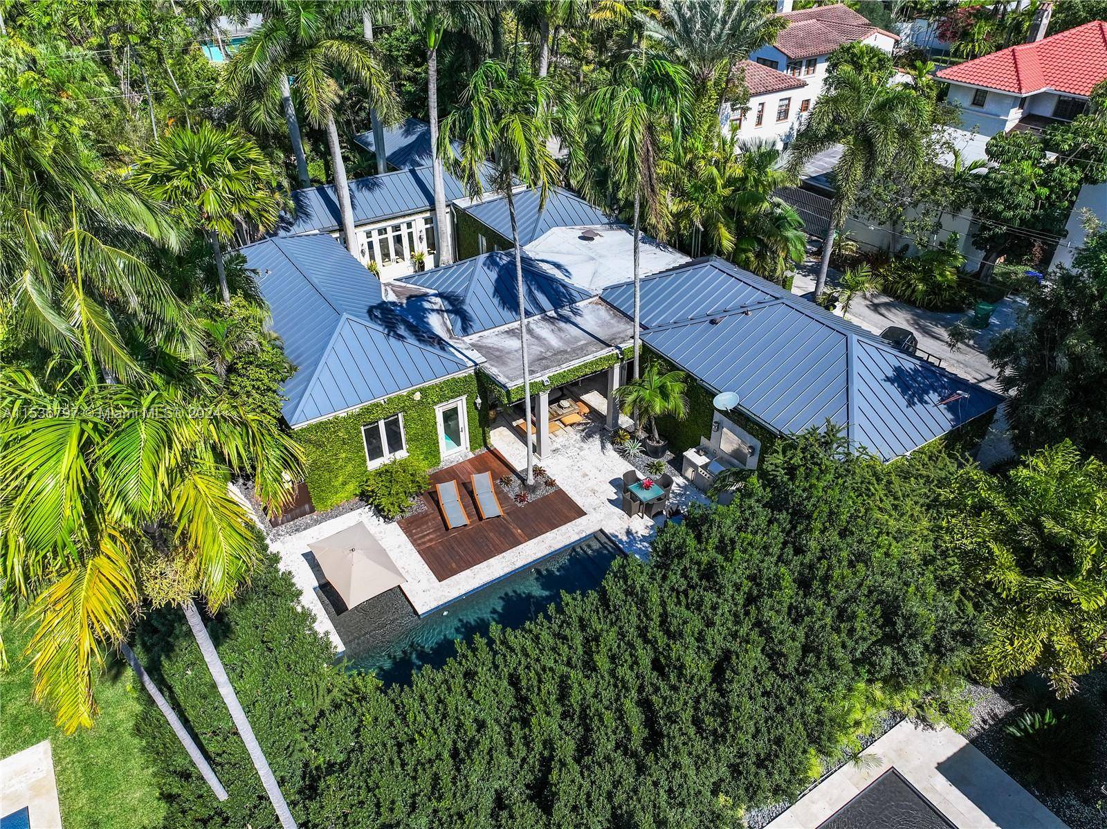 Experience luxurious living in Coconut Grove with this 5 bedroom, 4.