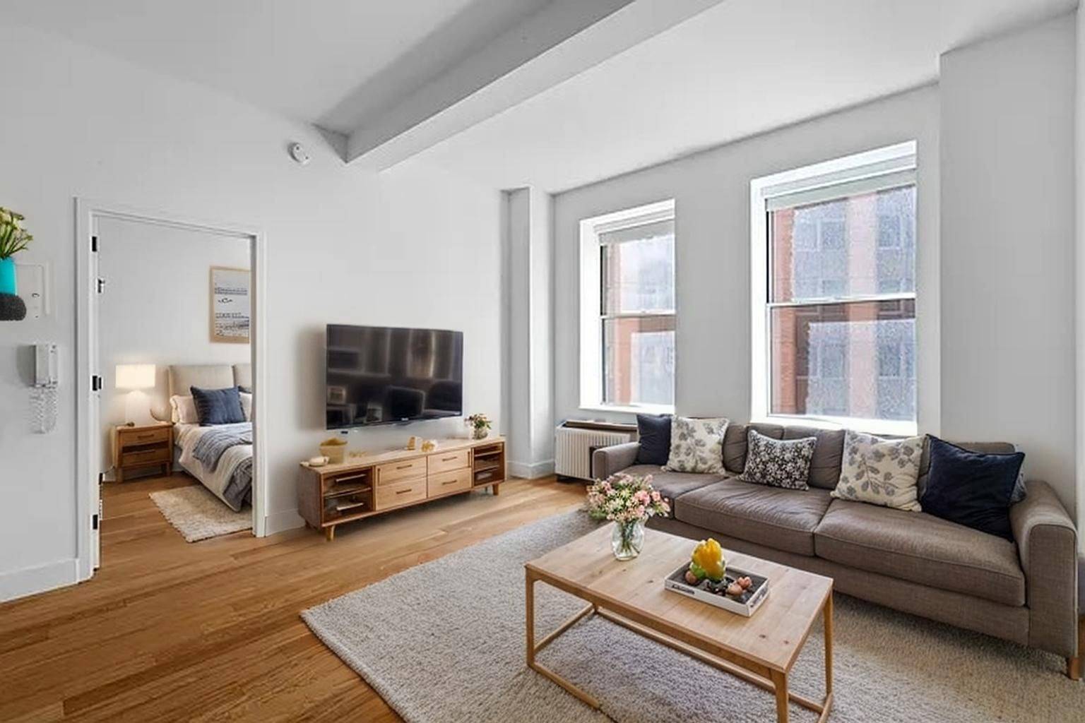 This renovated FiDi loft offers modern finishes, superb views, and exceptional light.