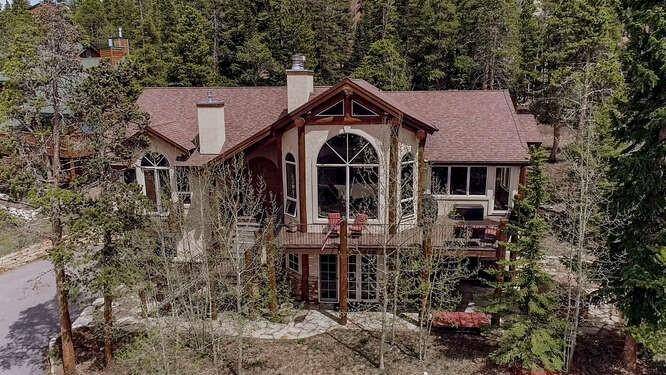 Situated above the Town of Breckenridge, this custom home offers breathtaking views of the Tenmile Range and ski resort.