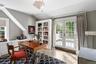 Home office with french doors, wood finished floors, and lofted ceiling