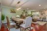 Beautiful adn luxurious flooring with recessed lighting and crown molding make for an extremely warm and inviting space.