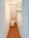 Spacious closet with light wood-style floors