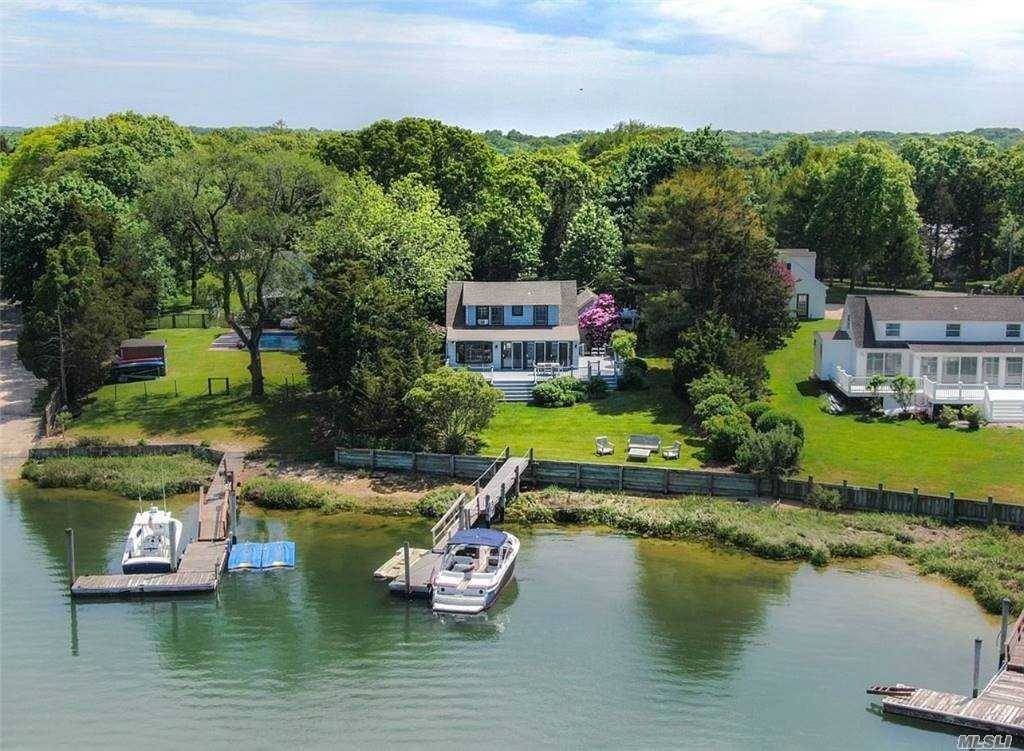 Southampton Shores charming waterfront Cottage sits on beautifully landscaped.