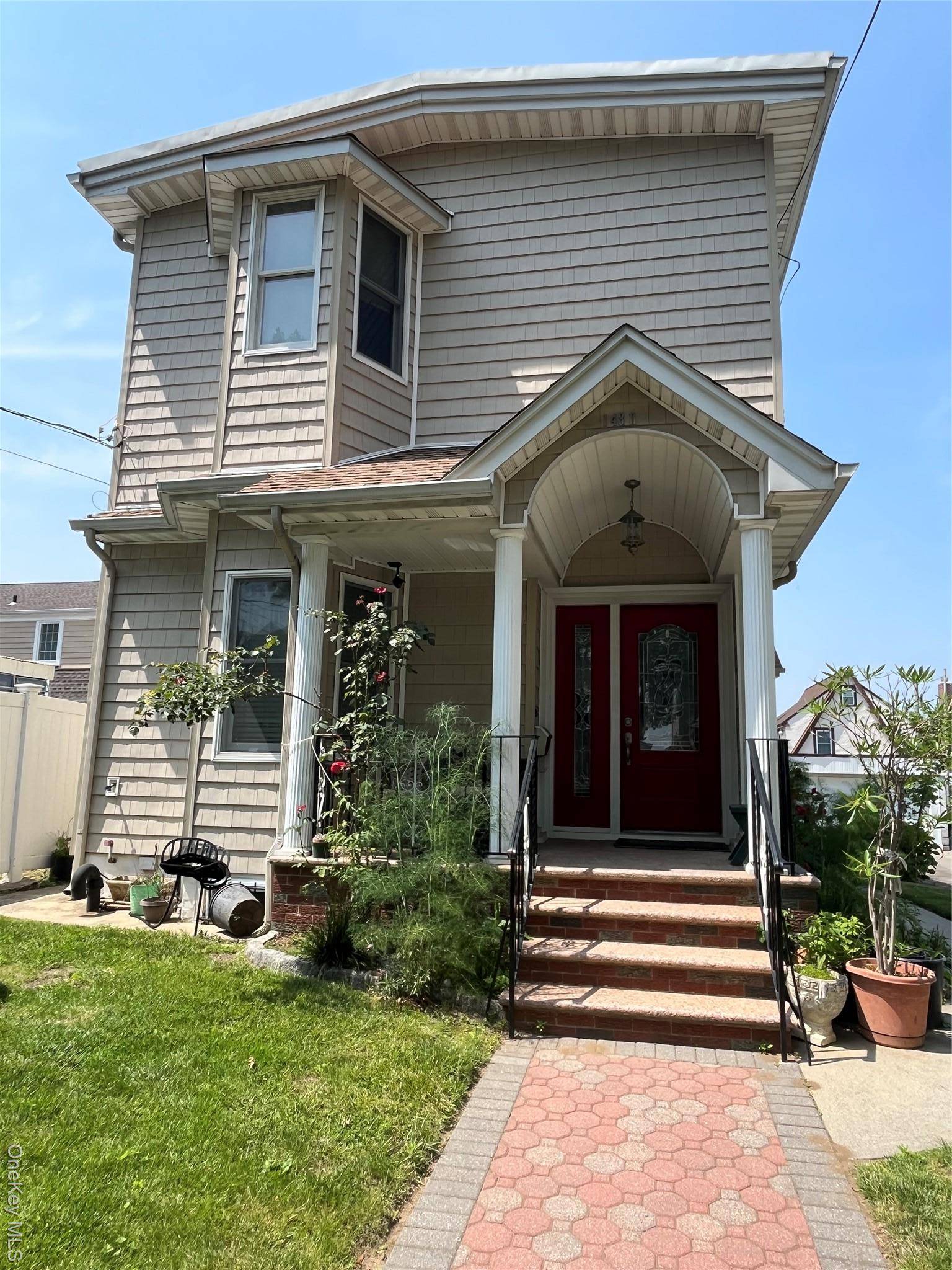 Rare opportunity ! ! Updated, South Facing, Legal 2 family in a quiet residential section of Whitestone.