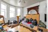 Bedroom with hardwood / wood-style flooring and ceiling fan
