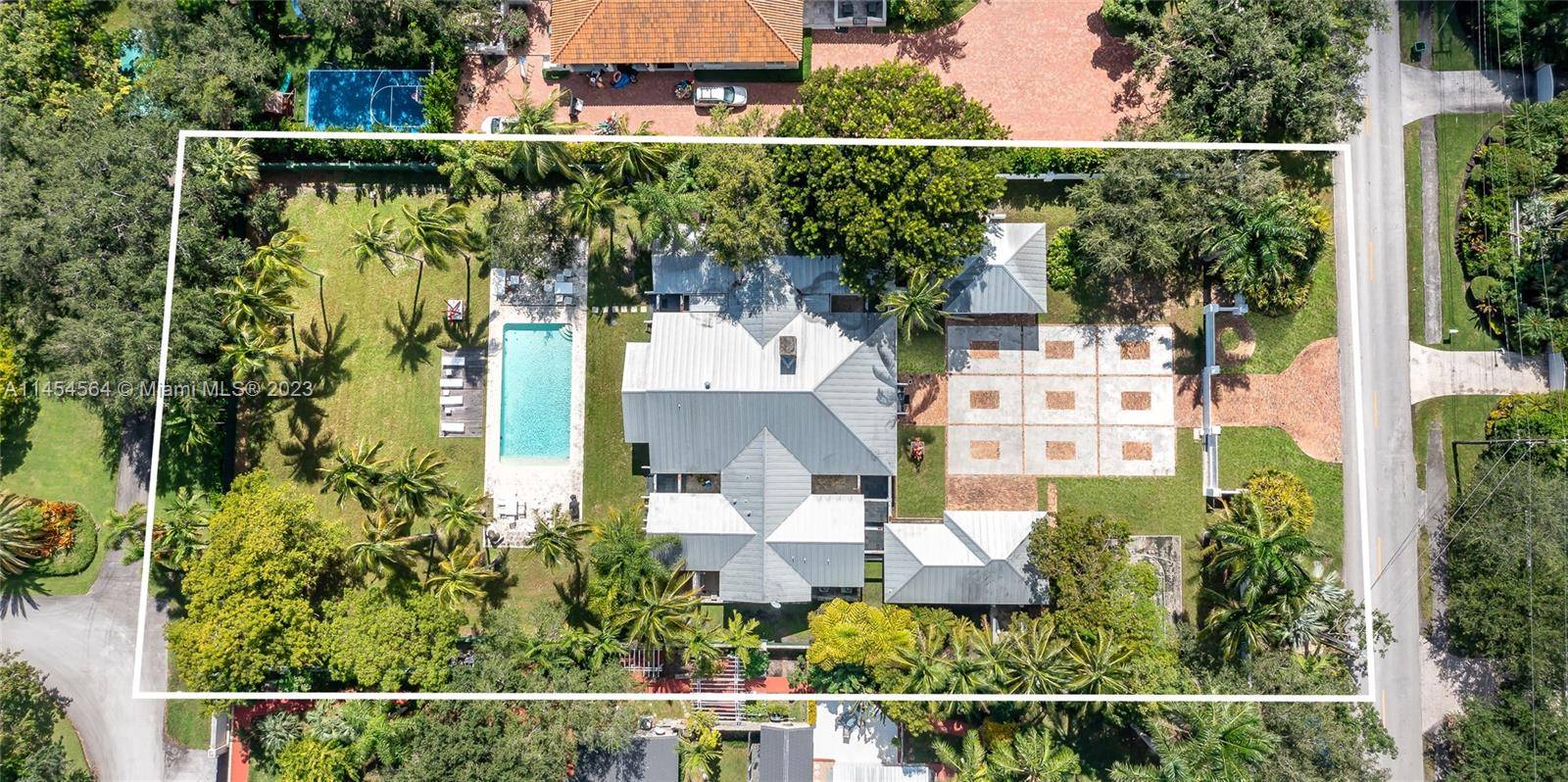 Key West style estate, situated on a sprawling 1 acre street to street lot in the desirable CORAL GABLES neighborhood.