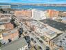 Birds eye view of property featuring a view of city and a water view