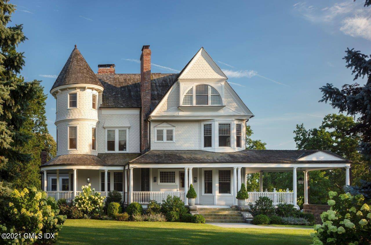 Majestic shingle style estate set upon highest point in Belle Haven.