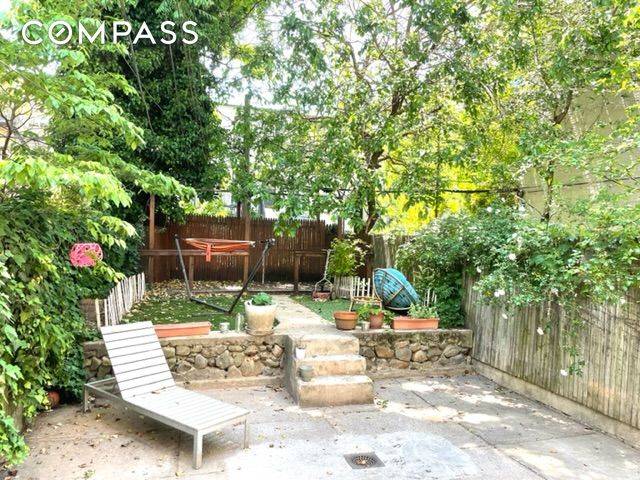 Welcome home to a Park Slope backyard oasis.