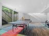 Recreation room featuring carpet, recessed lighting, and a wall of windows