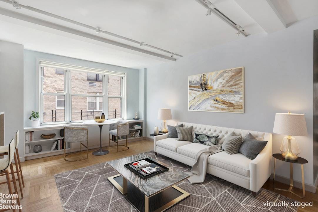 Beautifully gut renovated two bedroom, one and a half bath apartment with wall of 9 south facing windows and 1 west facing window at 60 Gramercy Park North.