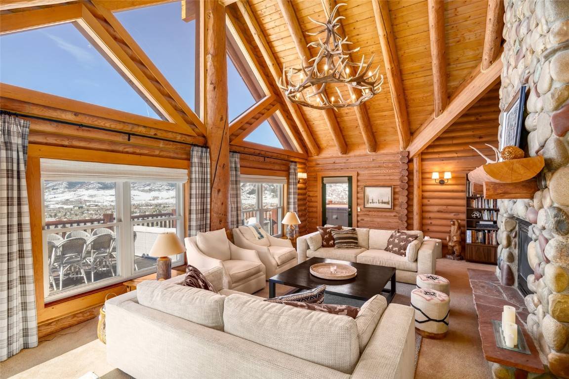Step into the ideal mountain lifestyle with this beautiful five bedroom log home nestled a mile from the base of the majestic Steamboat Ski Resort.