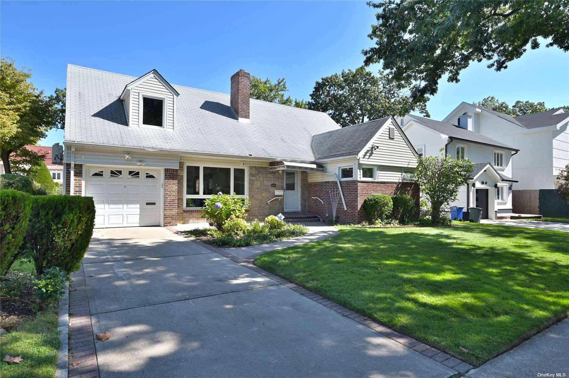 Welcome to this beautifully renovated single family home in the charming neighborhood of Hollis Hills.