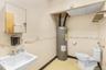 Bathroom with a sink and electric water heater