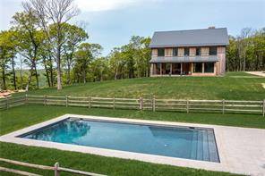Modern in the Litchfield Hills This modern masterpiece enjoys spectacular sunset views that stretch to the Catskill Mountains in the distance.