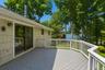 Sliding glass door from kitchen to deck overlooking yard and Hudson River.