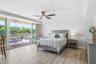 Oversized primary bedroom with access to the second balcony.