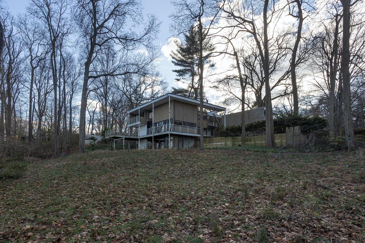 Back of property featuring a wooden deck