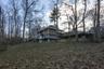 Back of property featuring a wooden deck
