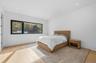 Bedroom with wood finished floors and recessed lighting