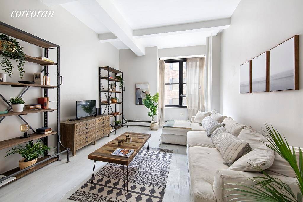 Super chic, spacious loft with 12' ceilings and pre war details in one of Greenwich Village's most coveted full service buildings.