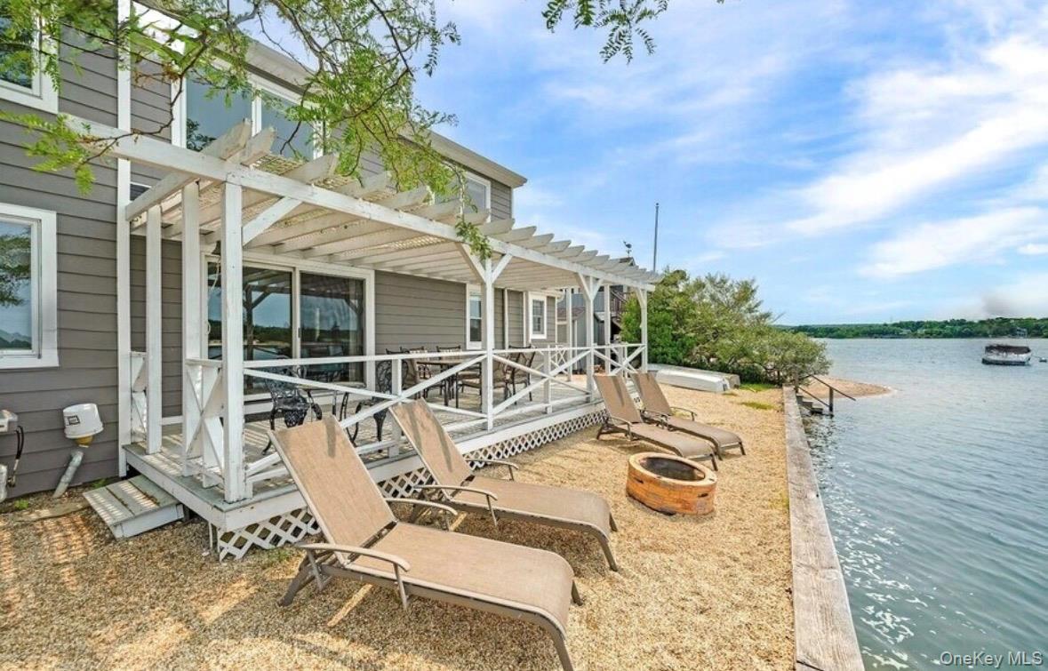 lounge chair area overlooking the water