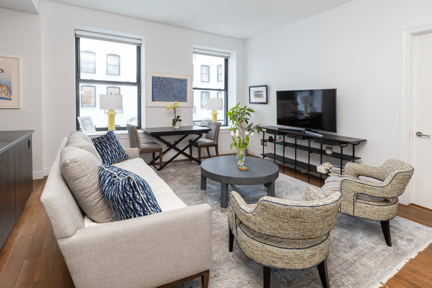 Overlooking the landscaped courtyard at The Grand Madison condominium, apartment 3N is a spacious and lofty 917 square foot 1 bedroom plus home office.