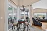 The dining area is off the kitchen and family room and also has sliders leading out to the lanai.