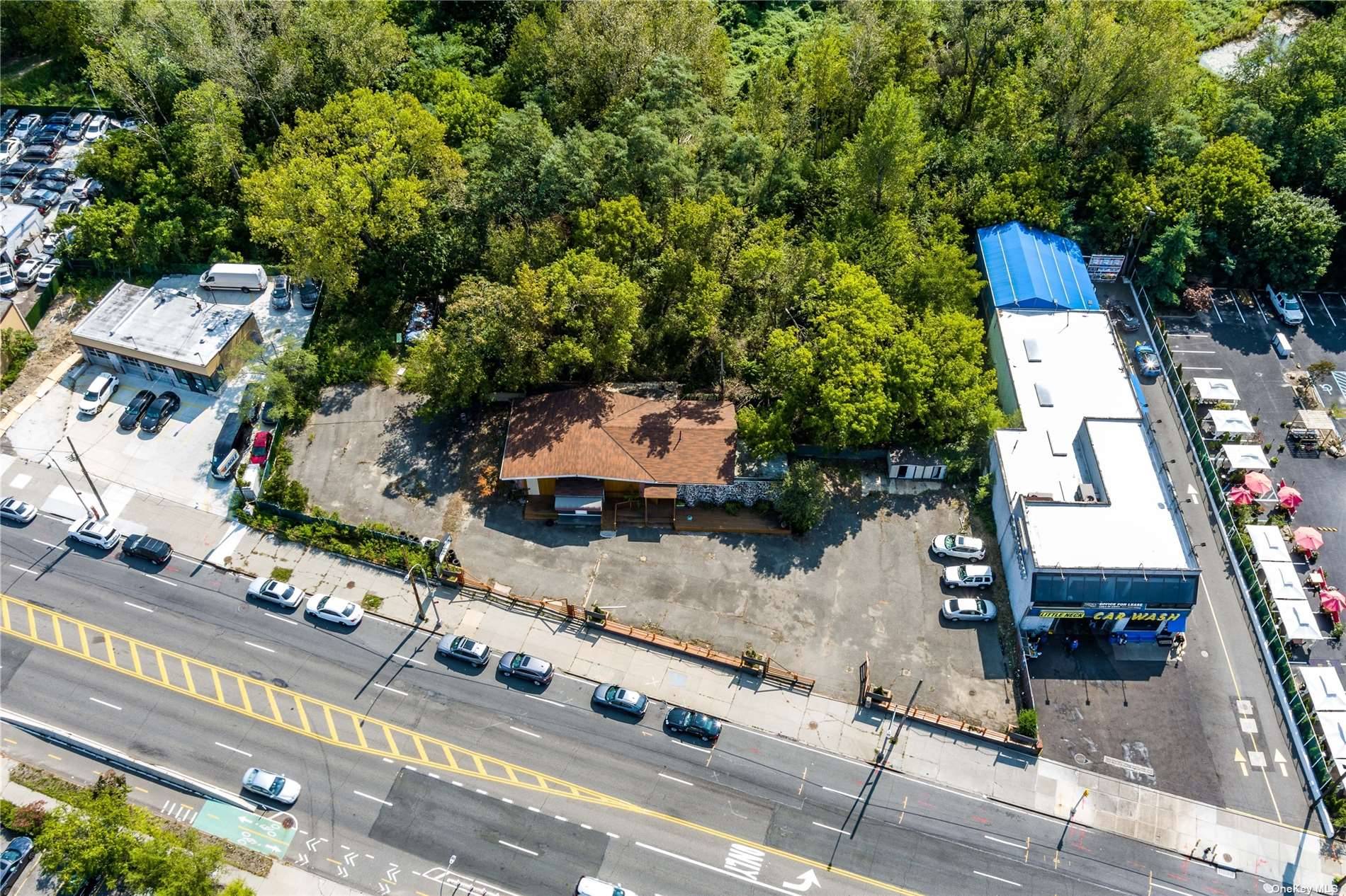 The lot is a highly visible 14, 375 SF lot that boasts 167 FT of frontage on major transit road Northern Boulevard.