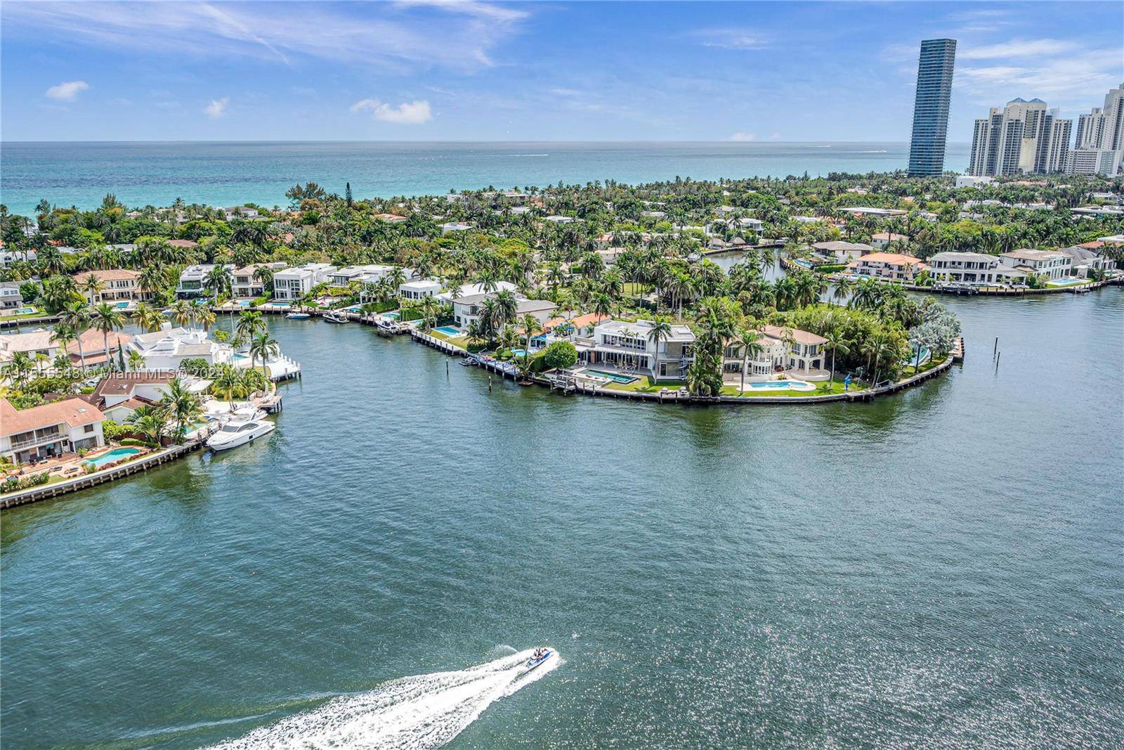 Step off your private elevator into this expansive waterfront residence offering 2 beds, a den a home office, and 2.