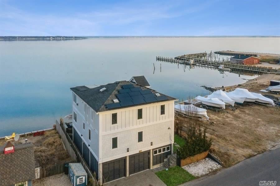 Sexy, Nautical Bayfront home located in the North Fork's coveted, New Suffolk w stunning 180 degree panoramic views of the Bay from nearly every room !