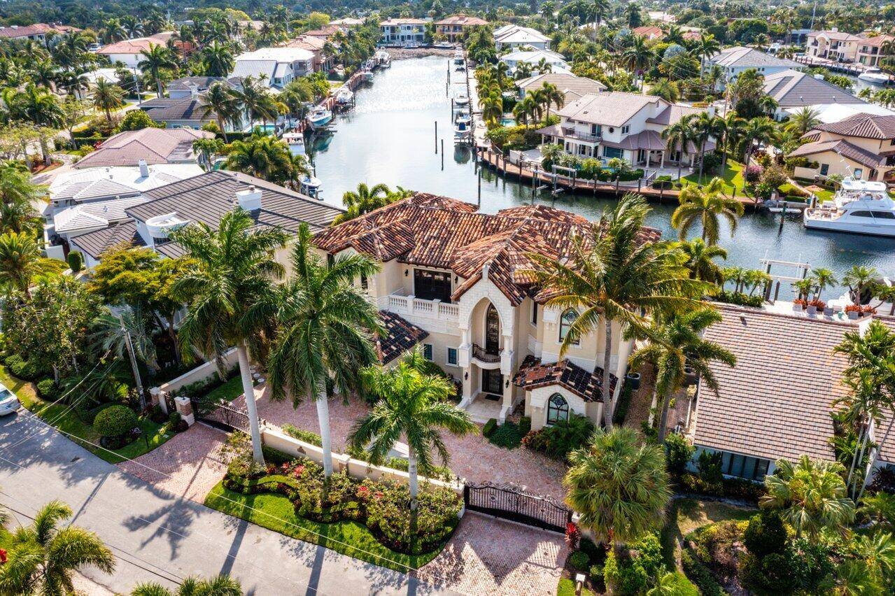 European inspired estate situated on over 80' of deep waterfront with beautiful sunset views, minutes to the Hillsboro Inlet and Atlantic Ocean.
