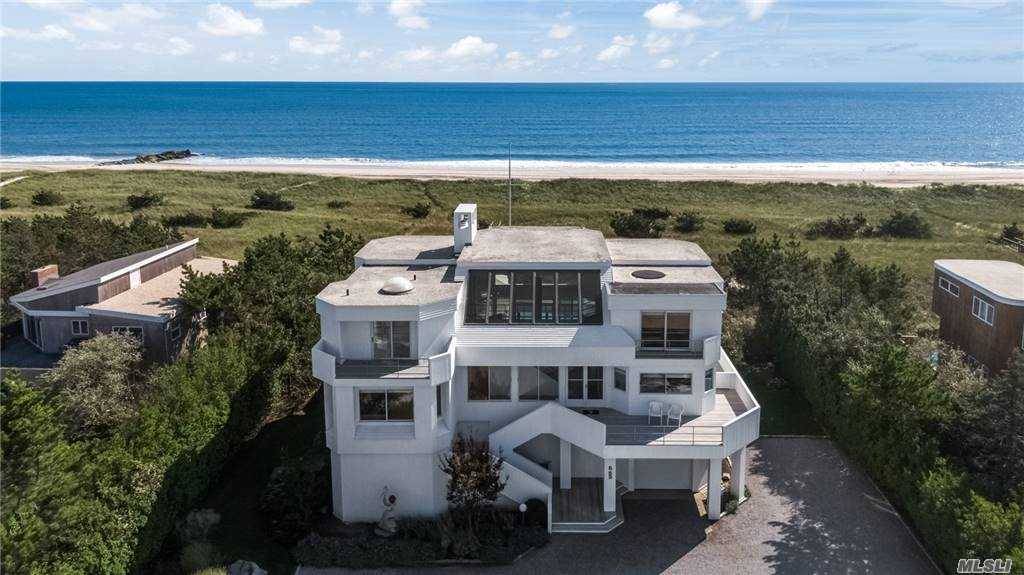 An impeccably maintained contemporary, this Dune Road beach house is a delight.