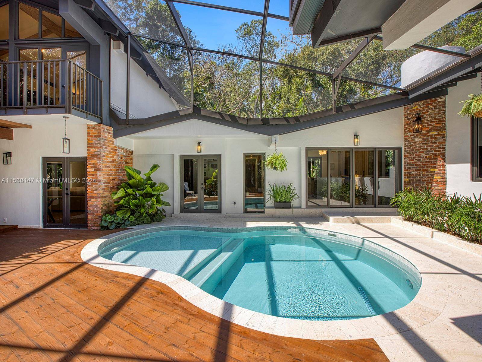 Contemporary haven within the exclusive enclave of Devonwood Pinecrest, this turnkey 5 bedroom 4 bathroom home is nestled amidst a captivating landscape and enclosed by lush trees.